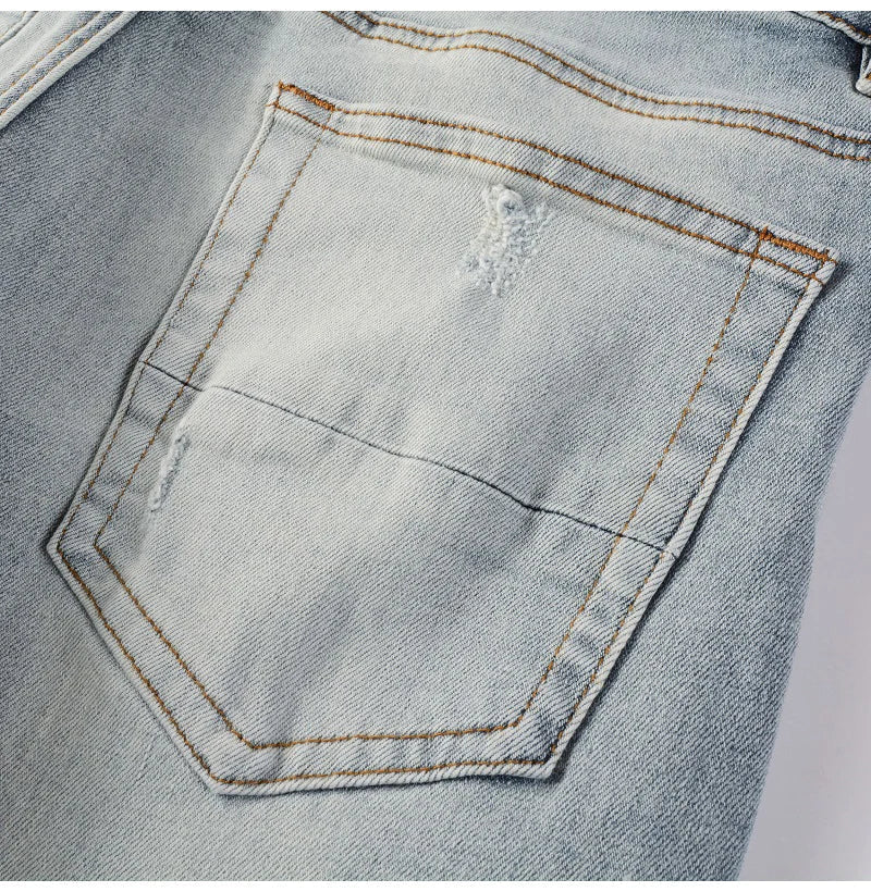 Men Leather Patches Denim Jeans Streetwear Holes Ripped High Stretch Pants Light Blue Skinny Tapered Trousers - PratSN
