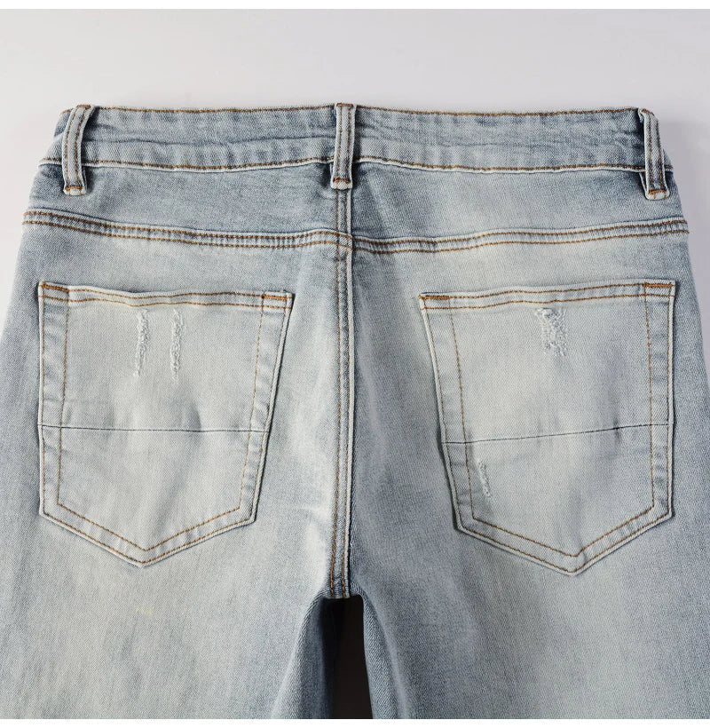 Men Leather Patches Denim Jeans Streetwear Holes Ripped High Stretch Pants Light Blue Skinny Tapered Trousers - PratSN